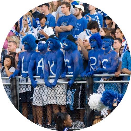 GVSU students with their bodies painted blue spelling out "Lakers"